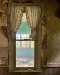 abandoned house with curtains