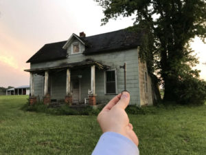 the key to an abandoned 1860 farmhouse