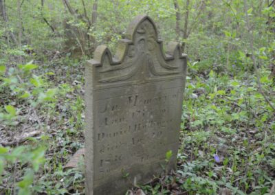 abandoned headstone in the woods in ohio