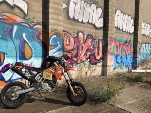 ktm supermoto against graffiti wall