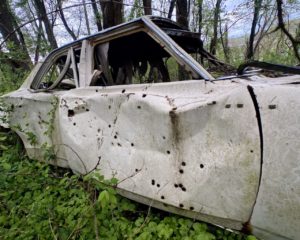 car-riddled-with-bullet-holes