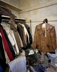 abandoned mens closet full of clothing