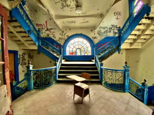 abandoned school blue staircase round looking wide