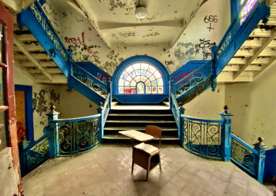 abandoned school blue staircase round looking wide