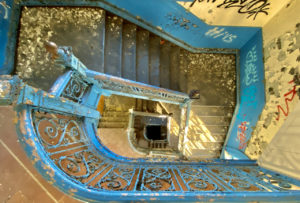 abandoned school blue staircase round looking straight down