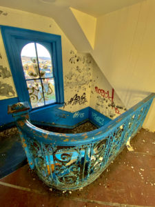 abandoned school blue staircase window