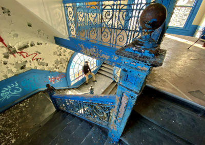 abandoned school blue staircase