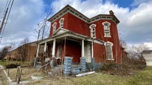 victorian style house abandoned front red brick