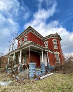 victorian style house abandoned front view