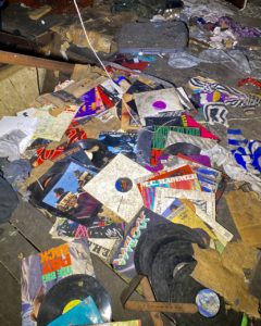 abandoned vinyl records on floor