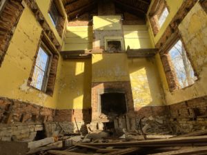 abandoned farmhouse bright yellow paint