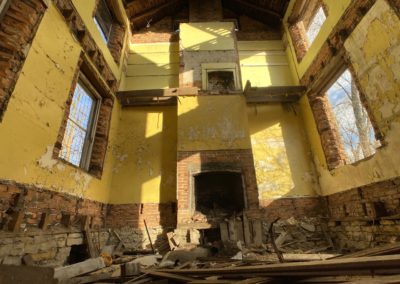 abandoned farmhouse bright yellow paint