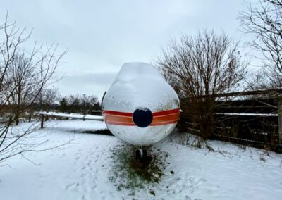 nose-cone-of-white-orange-airplace