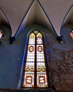 tall-stained-glass-window-abandoned-church