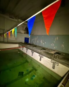 abandoned-ymca-pool-flags-across
