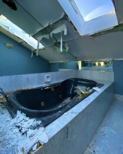 abandoned-mansion-master-bath-gold-tub-skylights