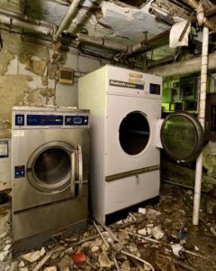 abandoned-commercial-washer-dryer-in-basement