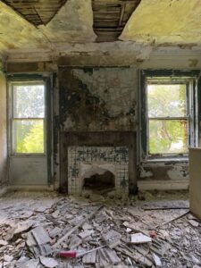 abandoned-victorian-mansion-fireplace-windows