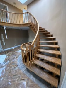 abandoned-mansion-wood-curved-staircase
