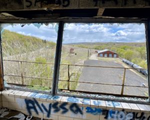 looking-out-of-abandoned-train-control-tower
