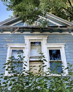 abandoned-victorian-house-front-attic-window