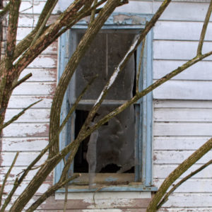 abandoned window blue frame