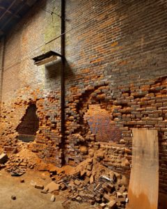 brick-walls-caving-in-with-holes
