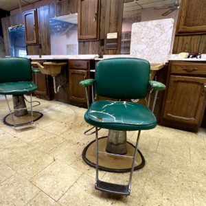 abandoned green barber shop chairs