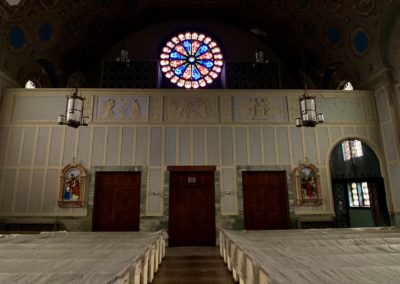large round stained glass in an abandoned church