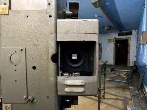 abandoned-vintage-35mm-theater-projector-blue-walls