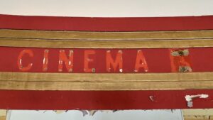 abandoned-theater-red-gold-cinema-sign