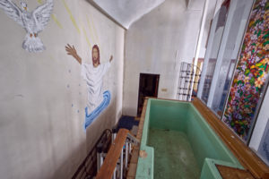 full immersion baptism church with dove mural