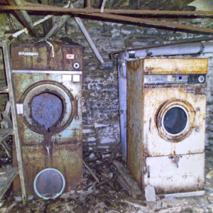 abandoned laundry in basement of a mansion