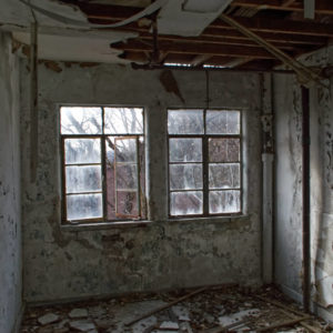 steel frame windows in abandoned apartment building