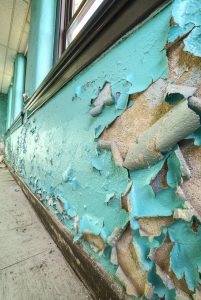 teal-flaking-paint-walls
