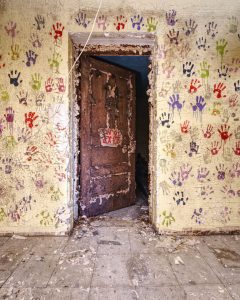 creepy-room-with-handprints-on-walls-door