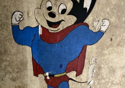 mighty mouse mural painting in an abandoned school