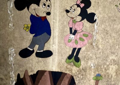minnie and micky mouse vintage painting in abandoned school