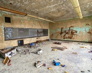 abandoned 1920s school with chalk boards