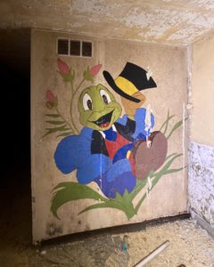 jiminy cricket mural painting with hat