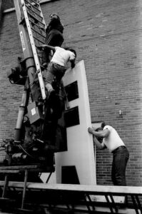 fairborn-theater-sign-installation-men-working-ladders