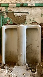 vintage-urinals-dayton-green-walls